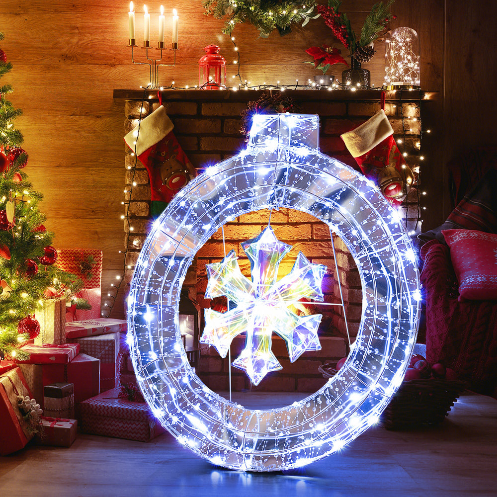 33-inch lighted snowflake wreath with 128 LED lights, ideal for indoor and outdoor Christmas decoration.