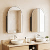 Brushed metal wall-mounted storage cabinet with arched mirror, featuring adjustable shelves for stylish bathroom organization.