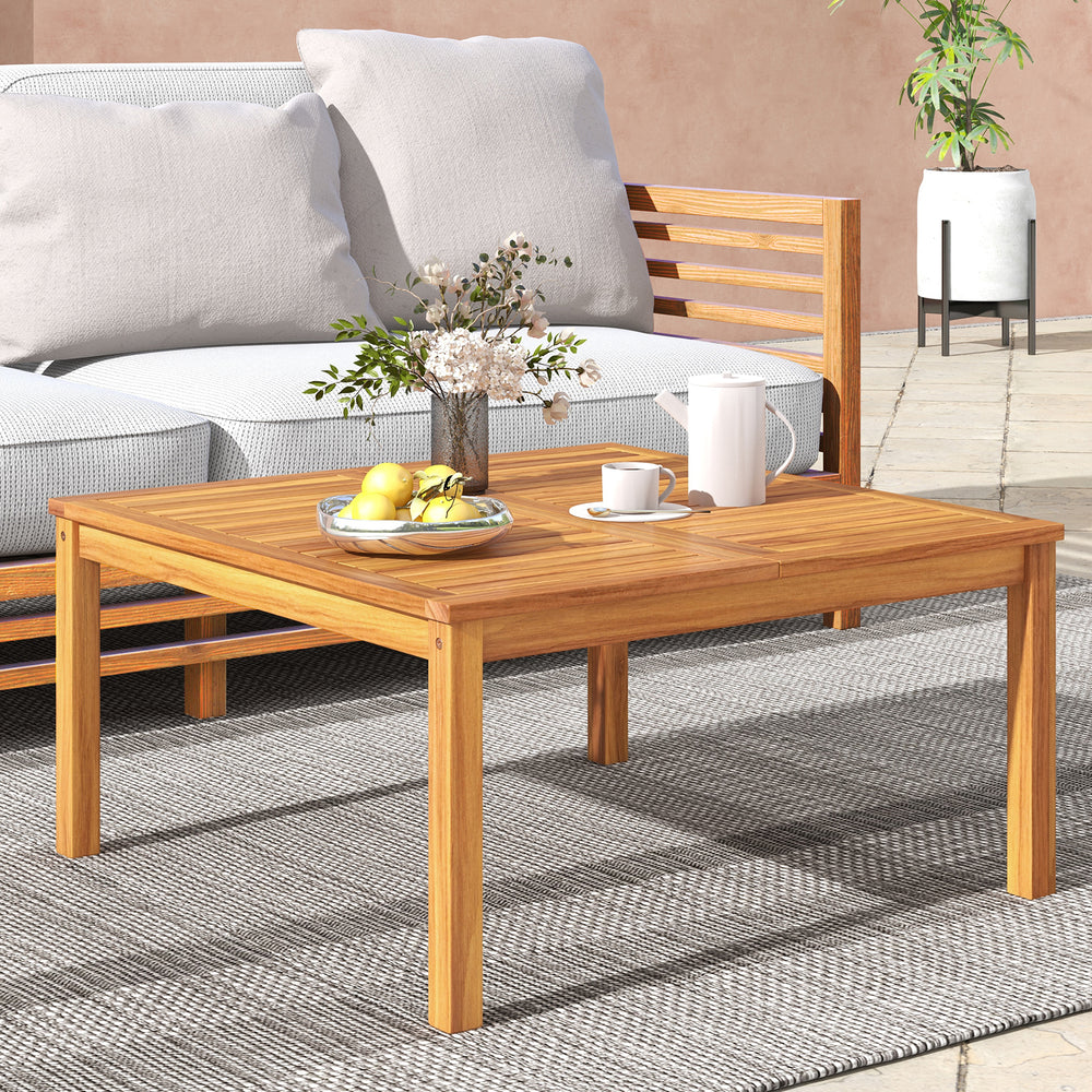 Acacia wood coffee table with spacious tabletop, ideal for serving drinks in backyard or poolside settings.