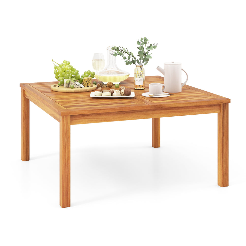 Acacia wood coffee table with slatted design, perfect for outdoor use in backyard or poolside settings.