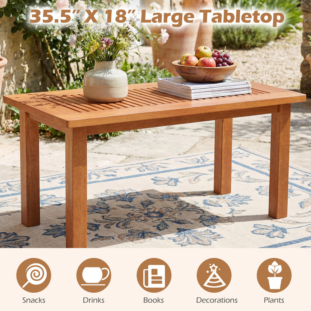 Rectangular 35.5" outdoor coffee table with slatted top, made of solid hardwood, perfect for backyard use.
