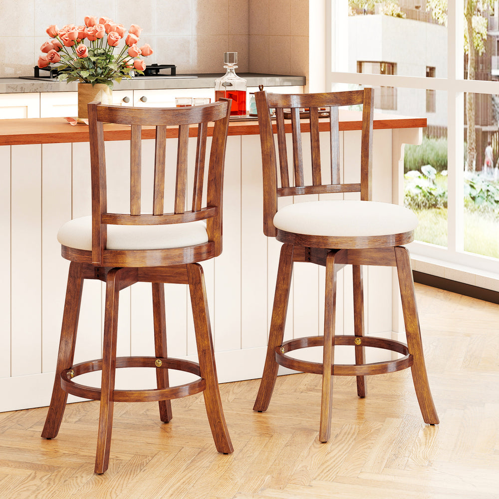 Set of 2 360° rotating counter height chairs with upholstered seats and backrests in solid rubberwood for kitchen use.