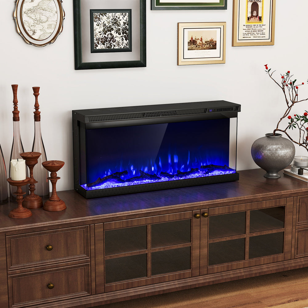 Three-sided electric fireplace insert with remote control, showcasing blue flames, perfect for modern living room.