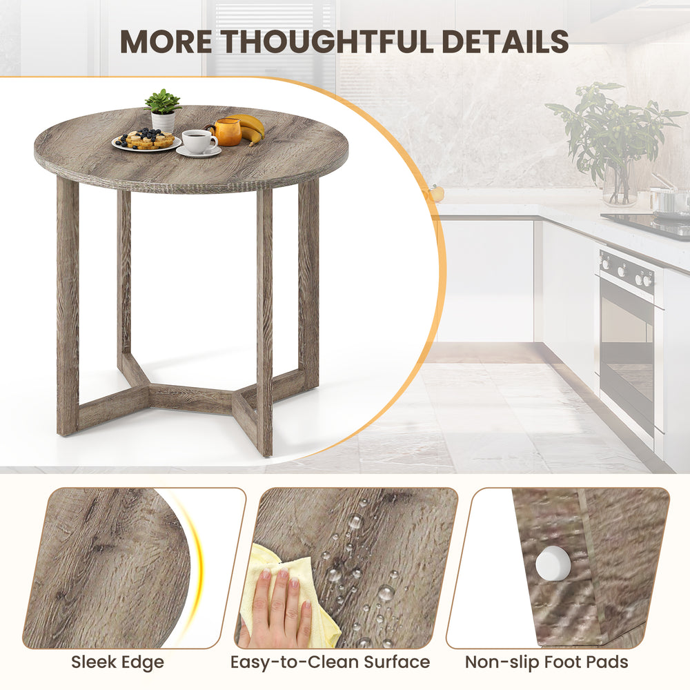 Round 36-inch grey wood dining table with wing-shaped pedestal base, featuring a smooth surface and non-slip foot pads.