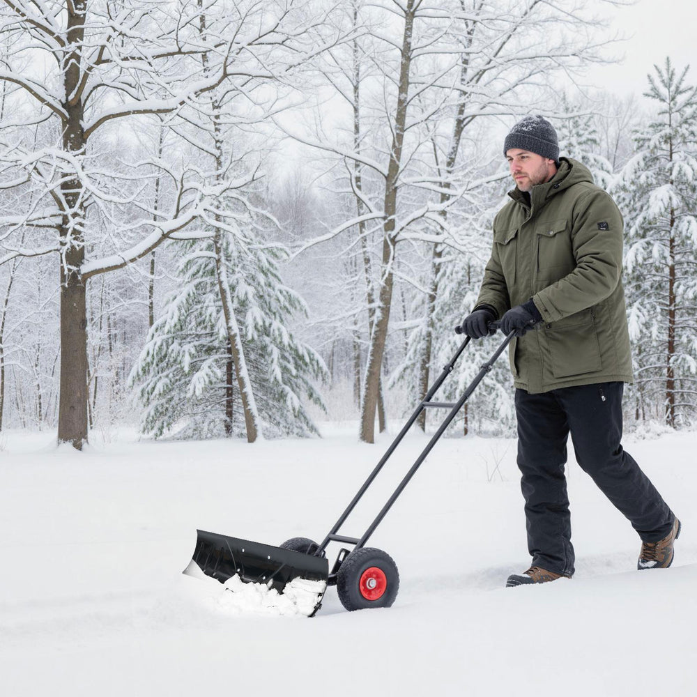 Wheeled 36-inch snow shovel with a powder-coated blade and 10" anti-slip tires for stable snow removal on smooth.