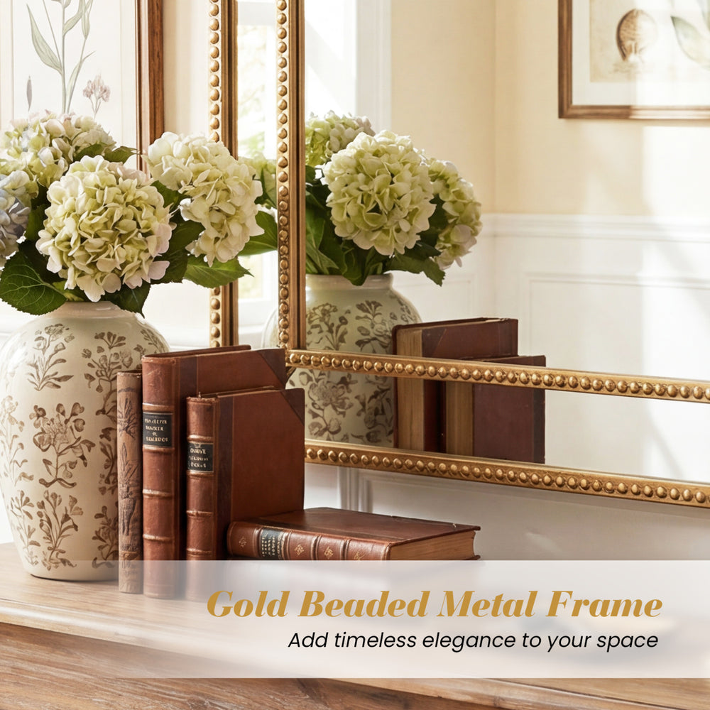 Decorative mirror with gold beaded metal frame, 36 x 24 inches, adds timeless elegance to living rooms and entryways.