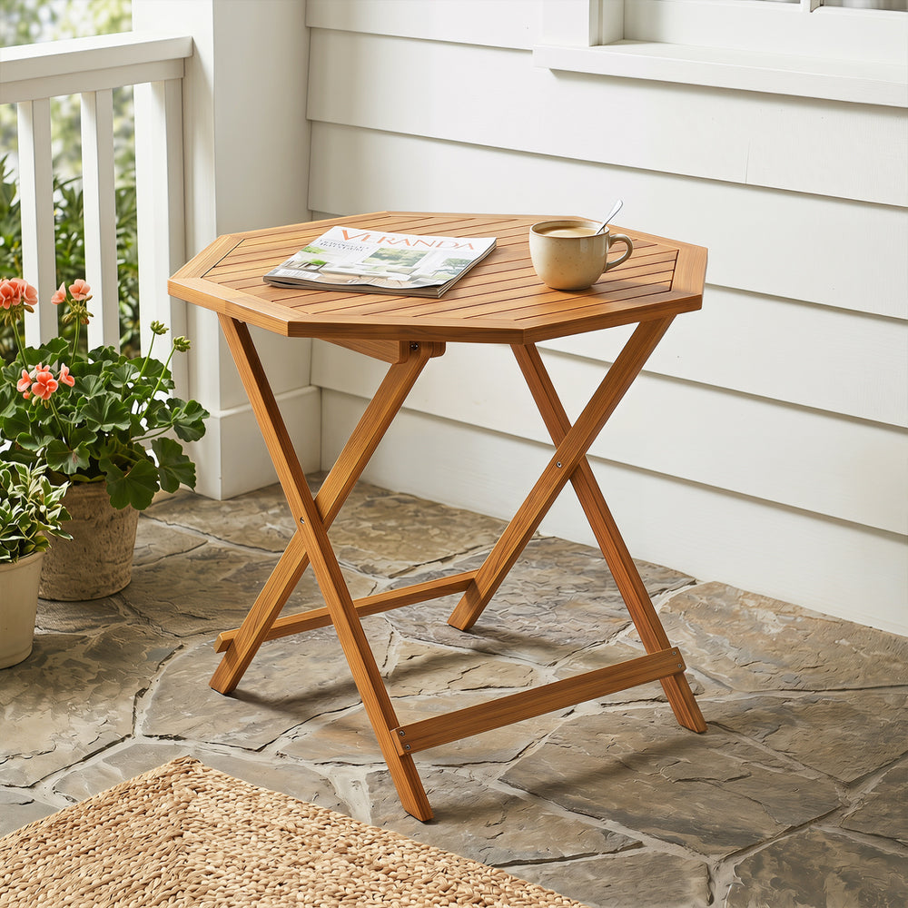 Acacia wood outdoor folding dining table with a slatted design, showcasing its octagonal shape and space-saving feature.