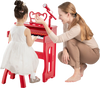 Child playing the red 37 keys music piano with microphone, featuring a detachable music stand and sturdy stool.