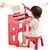 Kids playing the red 37 keys music piano with microphone and detachable music stand for fun music learning.