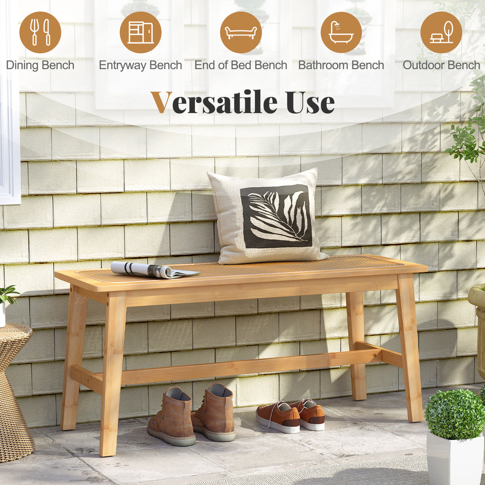 Bamboo dining bench with handwoven rattan seat, showcasing a stylish design for entryways and outdoor spaces.