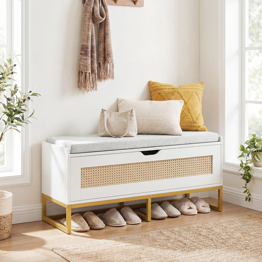 Rattan storage chest with padded seat in white and gold, ideal as a shoe bench for entryway or living room organization.
