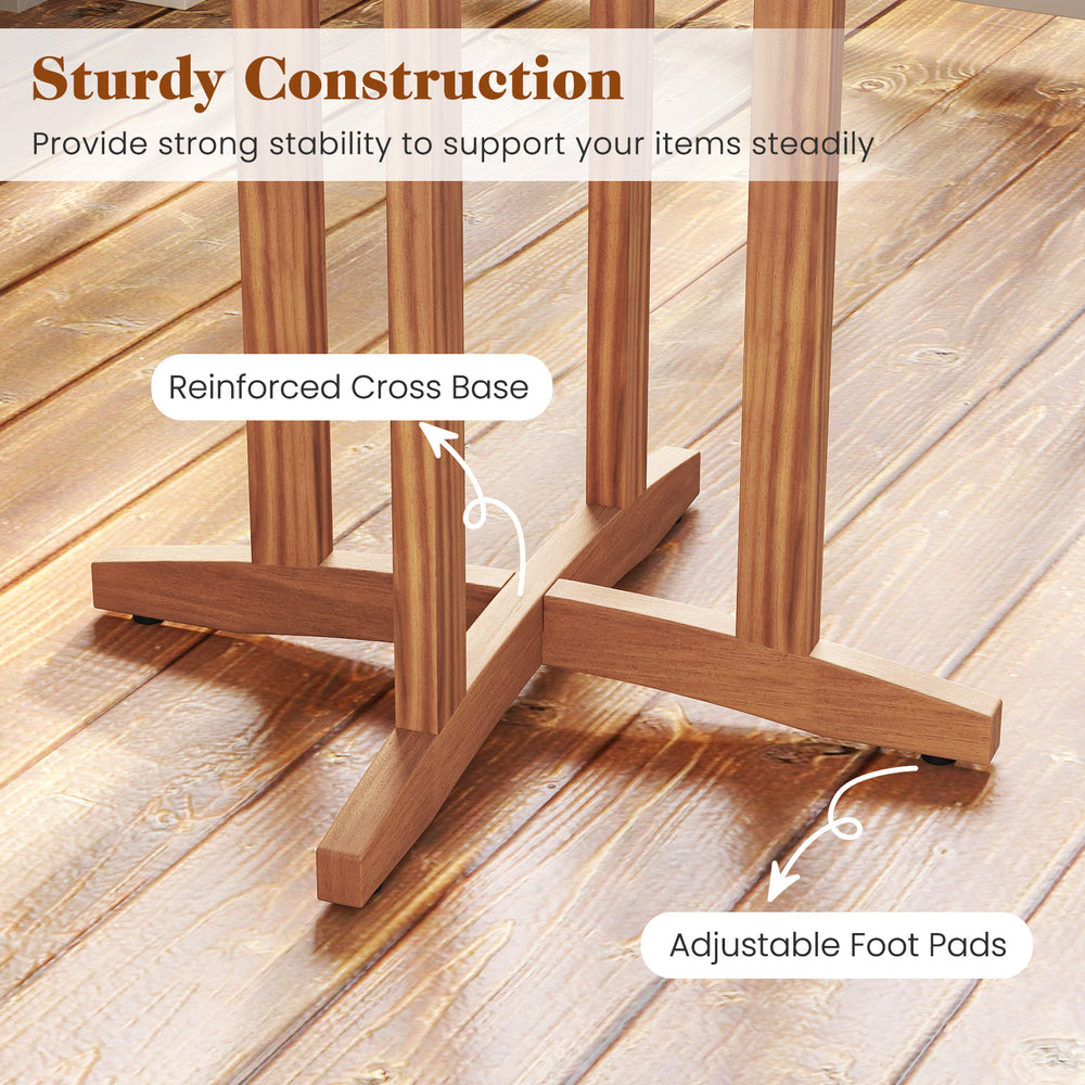 Reinforced cross base and adjustable foot pads of the 39-inch acacia wood bar table for outdoor stability.