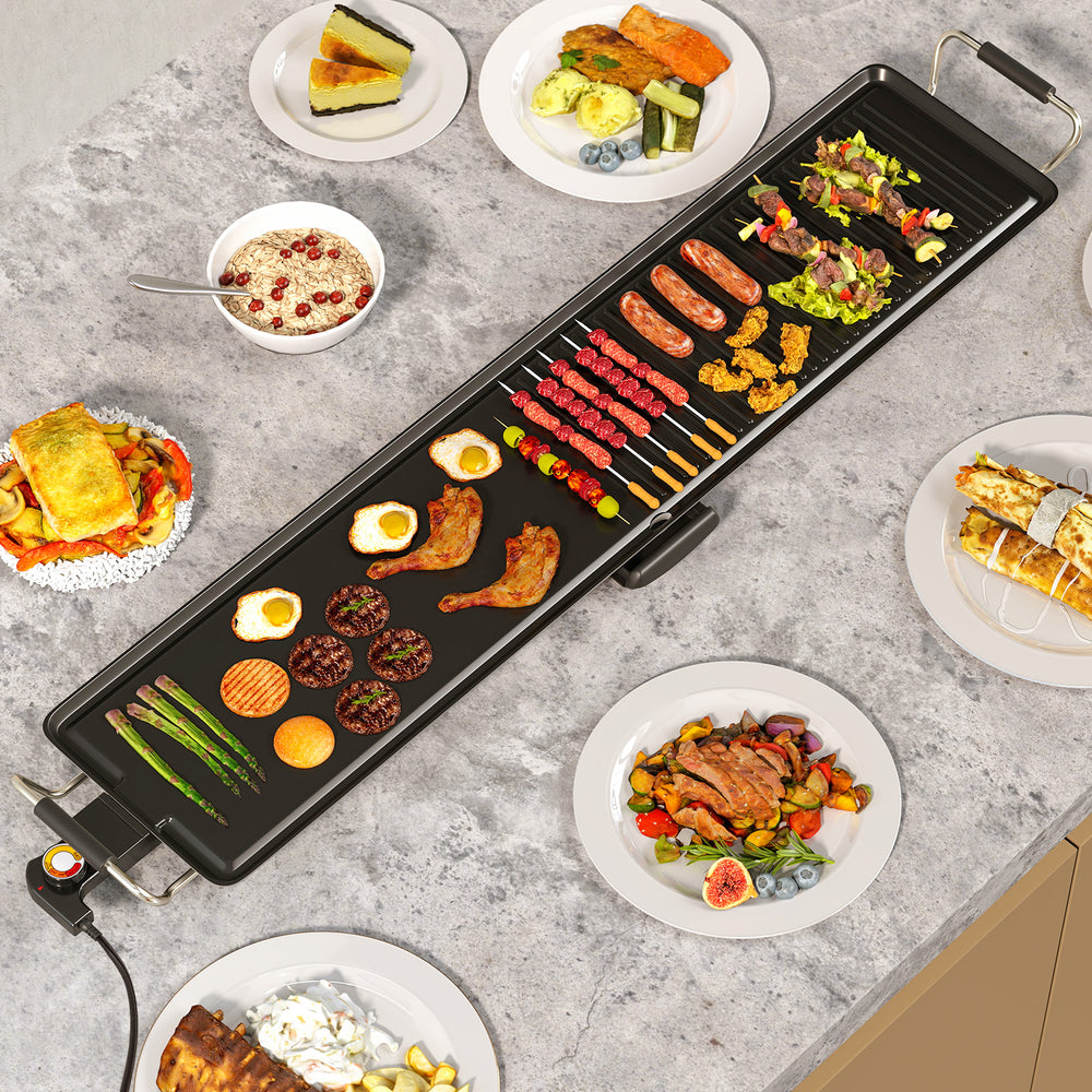 Extra large 39.5-inch electric griddle with two cooking surfaces, featuring various cooked foods for versatile meal.