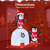 3D pre-lit igloo with two penguins, decorated with a wreath and 170 cold-white LED lights for indoor and outdoor use.