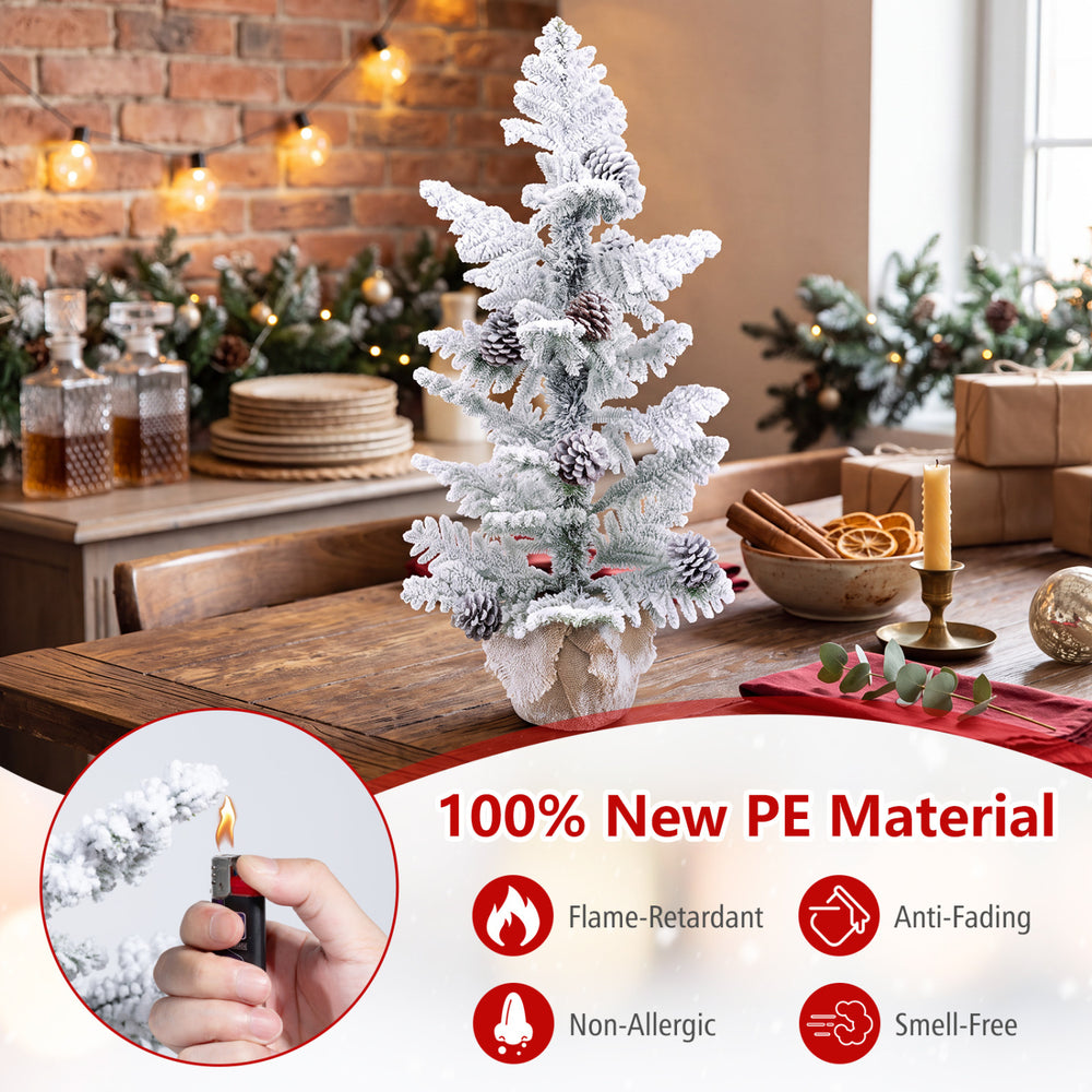 Mini tabletop Christmas tree featuring snow flocked PE leaves, pine cones, and a stable cement base for festive displays.