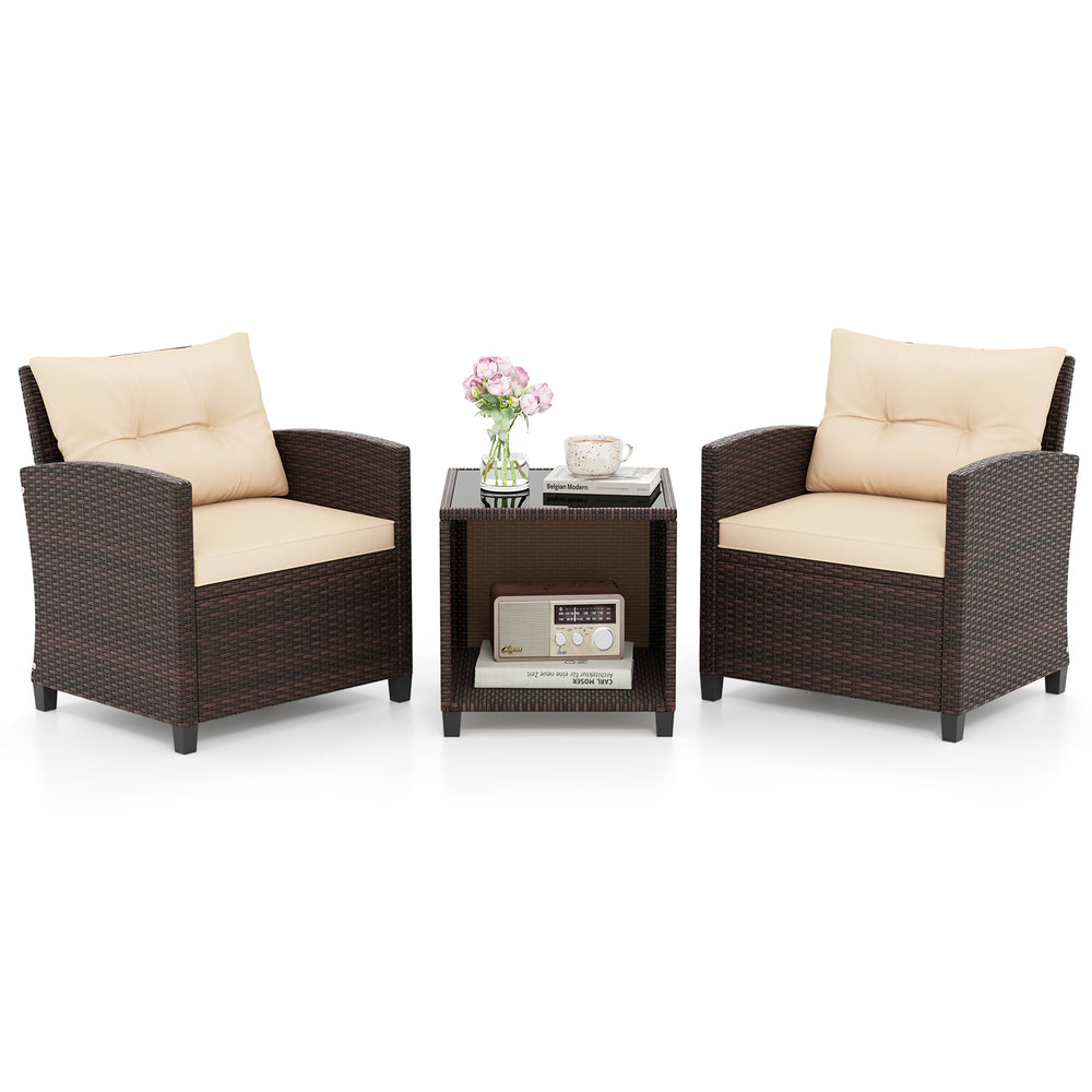 Two wicker chairs with beige cushions and a coffee table featuring storage, perfect for outdoor relaxation.