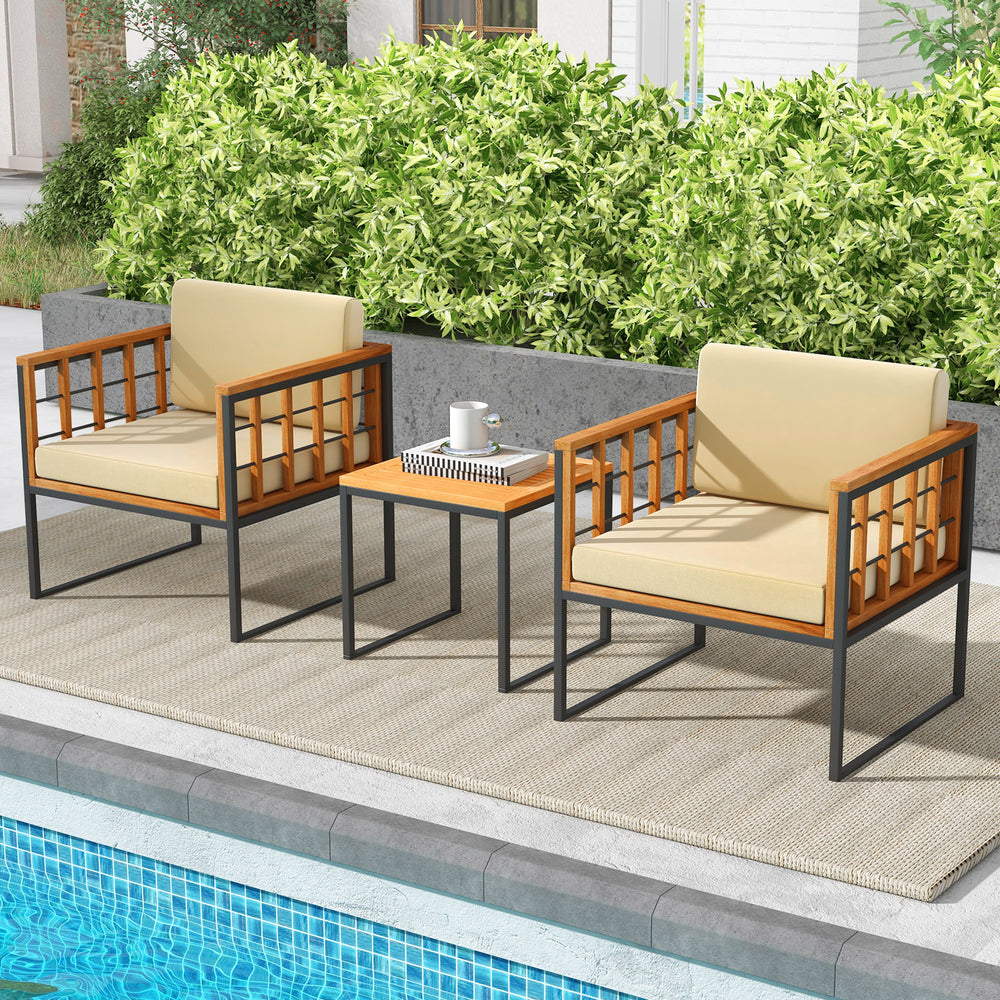 Two acacia wood patio chairs with beige cushions and a side table, perfect for outdoor relaxation by the pool.