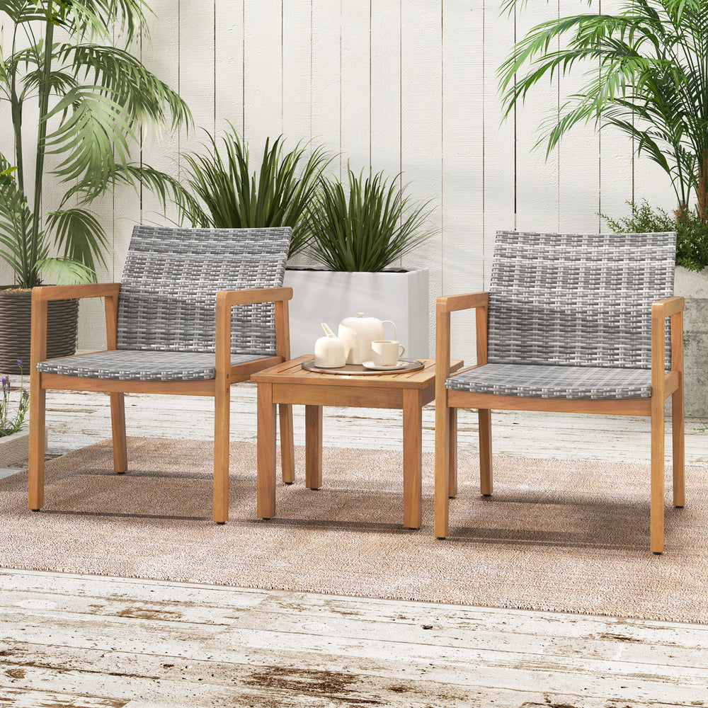 Two chairs and a coffee table from a 3-piece patio furniture set, featuring solid acacia wood and hand-woven PE rattan.