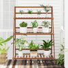 3-tier bamboo ladder shelf in brown, featuring a sturdy design for displaying plants indoors or outdoors.