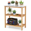 3-tier garden potting bench table with acacia wood frame and marble-like countertop, ideal for backyard and gardening.