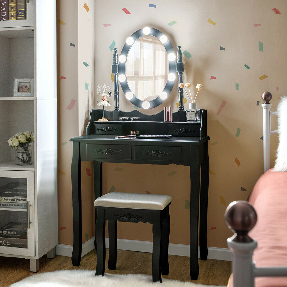Makeup dressing table in black with touch switch lighted mirror and cushioned stool, ideal for bedroom or bathroom use.