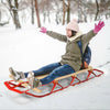 Kids wooden snow sled with metal runners and steering bar, designed for smooth sliding in the snow, suitable for ages 5.