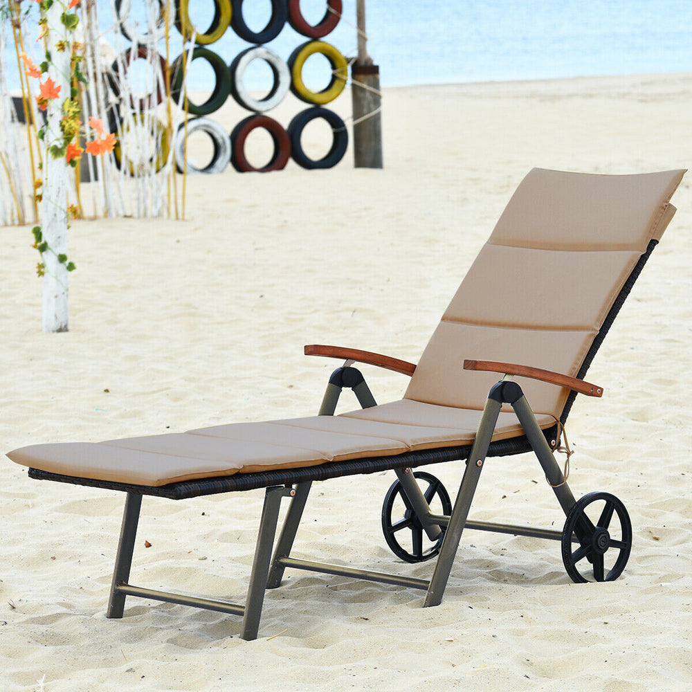 Outdoor rattan chaise lounge chair with adjustable backrest and wheels, perfect for beach and poolside relaxation.