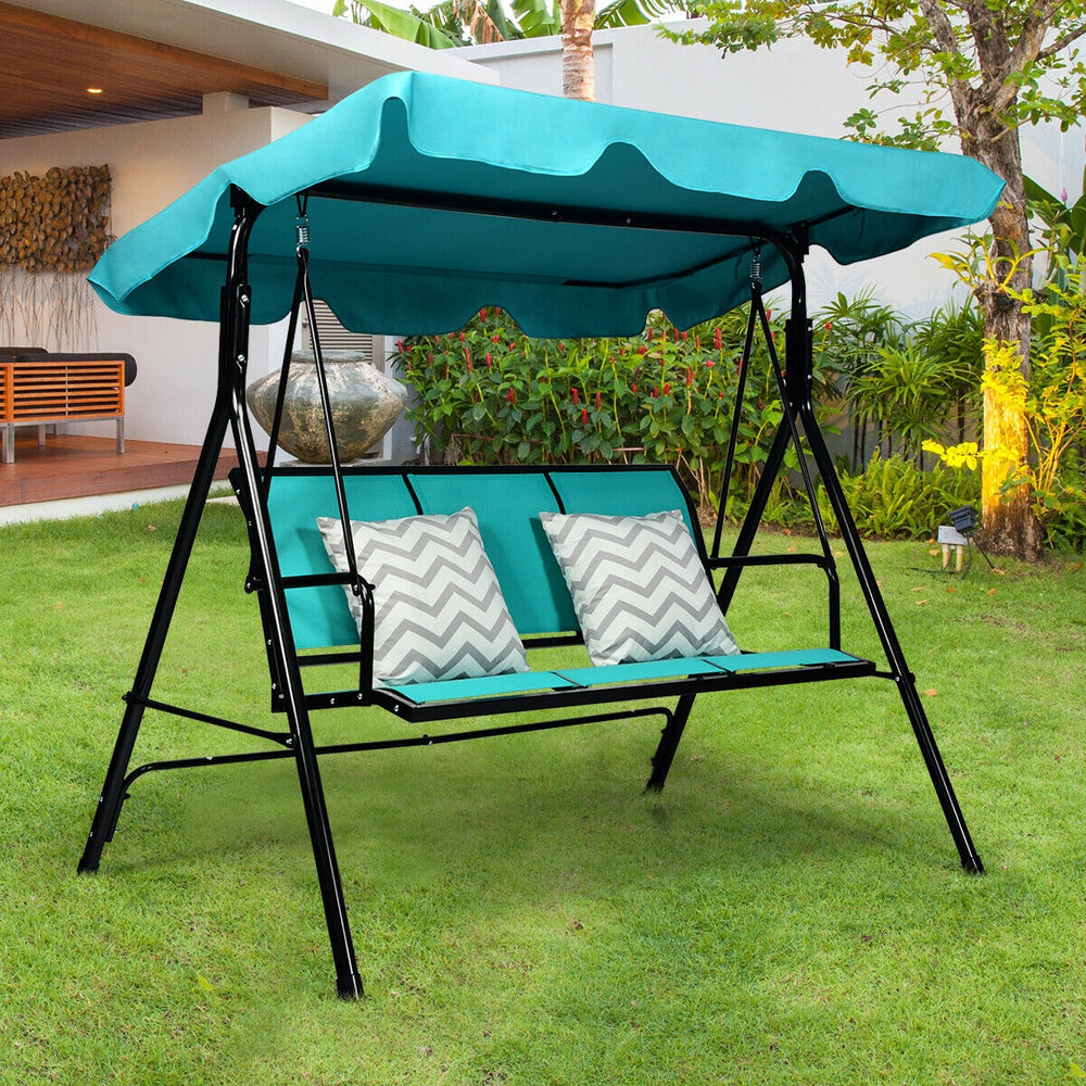 Three-person outdoor patio swing bench with blue canopy, durable steel frame, perfect for garden or poolside relaxation.