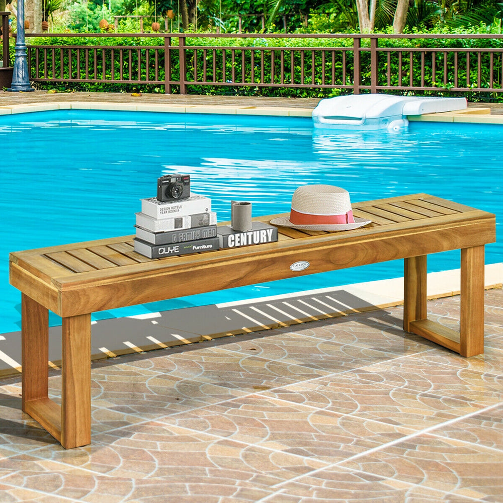 Acacia wood dining bench with slatted seat, natural teak color, perfect for patio or poolside seating.