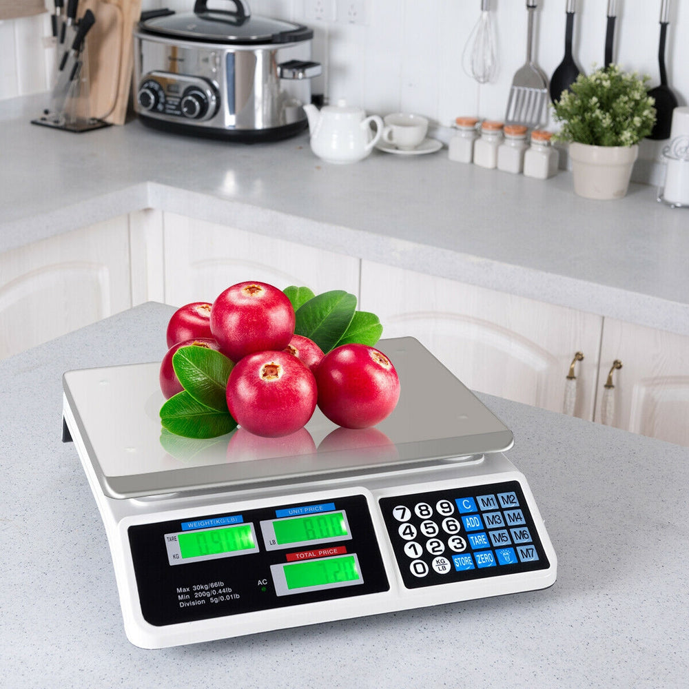Electronic price computing scale with LCD display, featuring fruits on the stainless steel top, ideal for markets and.
