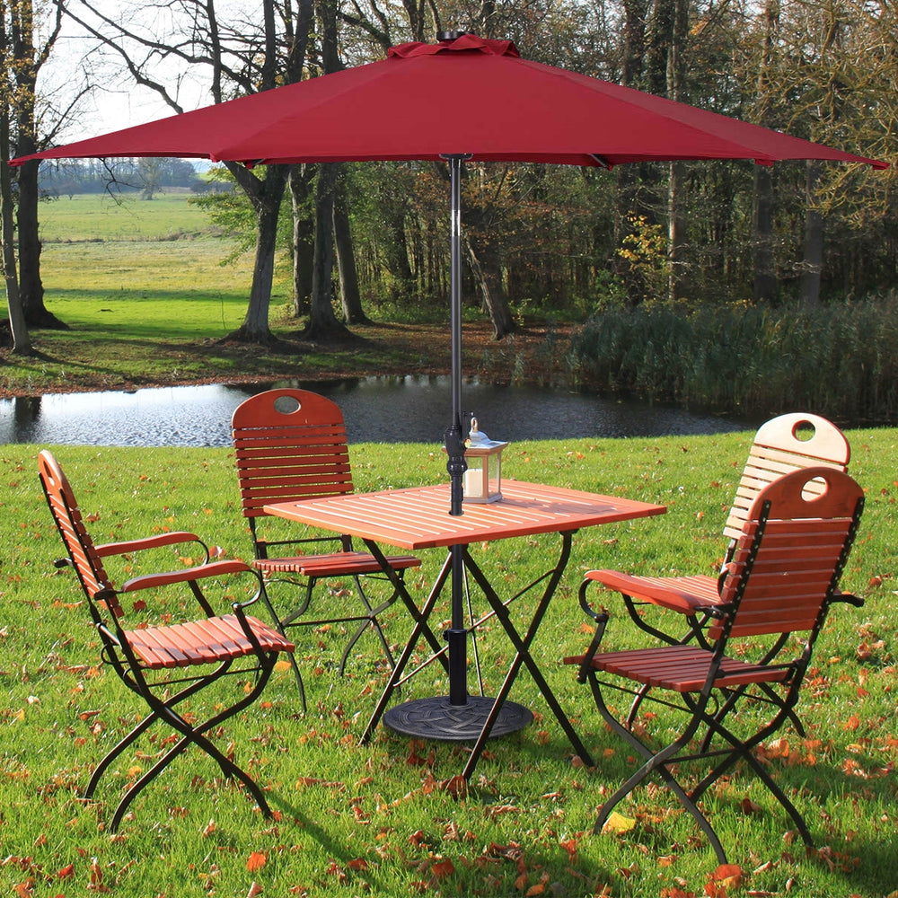 Heavy duty round umbrella base stand with bronze finish, designed for secure umbrella support in outdoor settings.