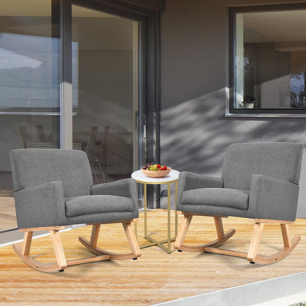 Gray upholstered rocking chairs with solid wood bases, featuring ergonomic design and cushioned seats for comfort.