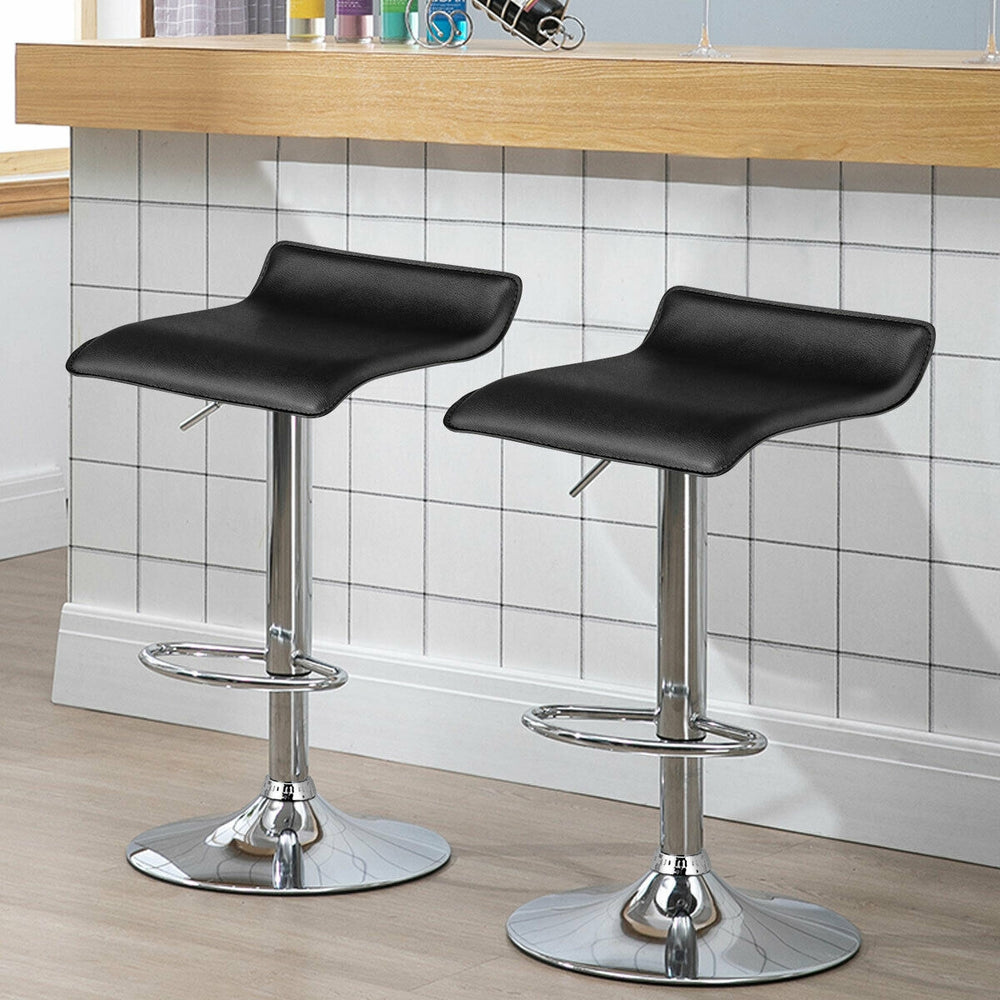 Set of 2 adjustable black PU leather backless bar stools with chrome bases, perfect for gatherings and parties.