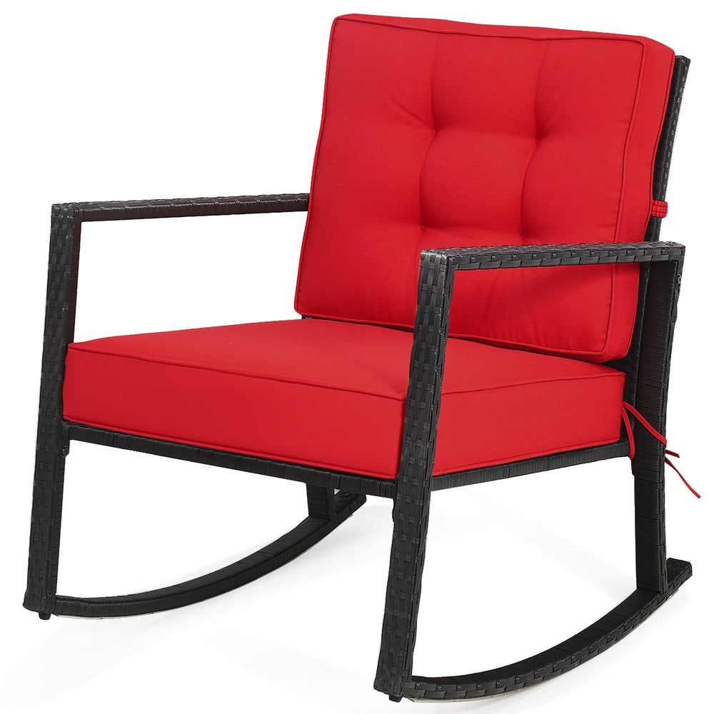 Red cushioned patio rattan rocking chair with sturdy metal frame, perfect for outdoor relaxation in garden or backyard.
