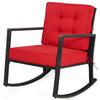 Red cushioned patio rattan rocking chair with sturdy metal frame, perfect for outdoor relaxation in garden or backyard.