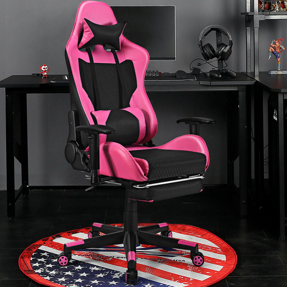 Pink PU leather gaming chair with adjustable armrests, lumbar massage pillow, and retractable footrest for comfort.