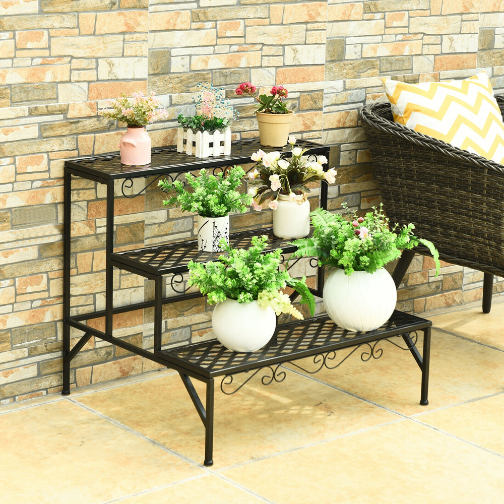 Three-tier metal decorative plant stand in black, featuring an elegant design, perfect for patio or garden use.