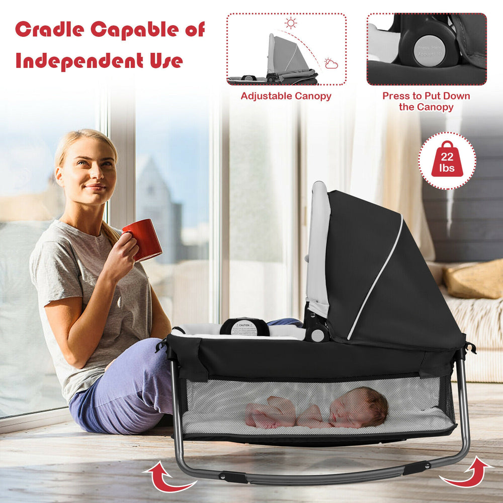 4-in-1 portable baby play yard in red with adjustable canopy, featuring a cradle and toys for versatile use.