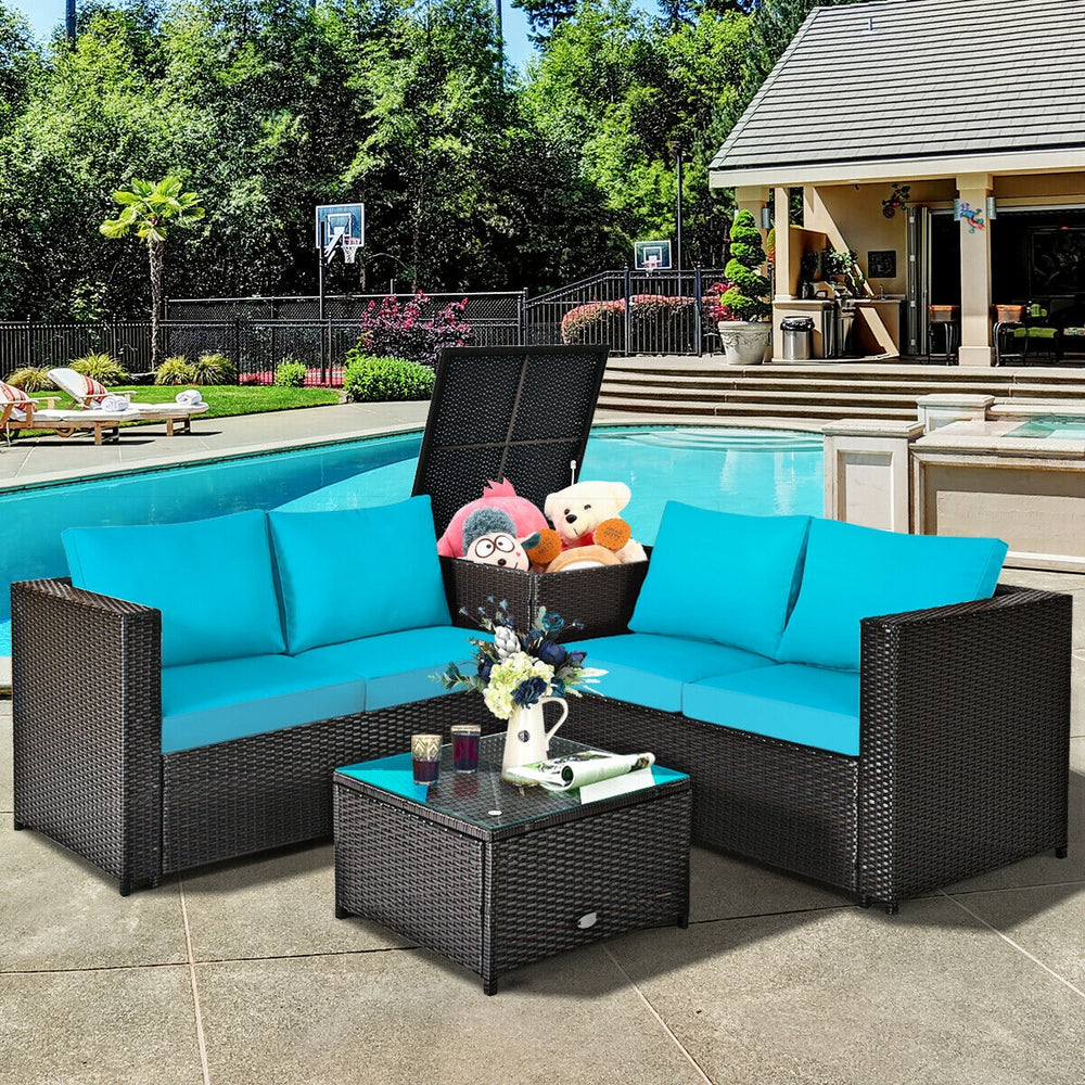 Turquoise cushioned loveseat and coffee table from a 4-piece outdoor patio rattan furniture set, ideal for poolside.