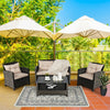 Outdoor rattan furniture set featuring two single sofas, a loveseat, and a glass table, perfect for backyard relaxation.