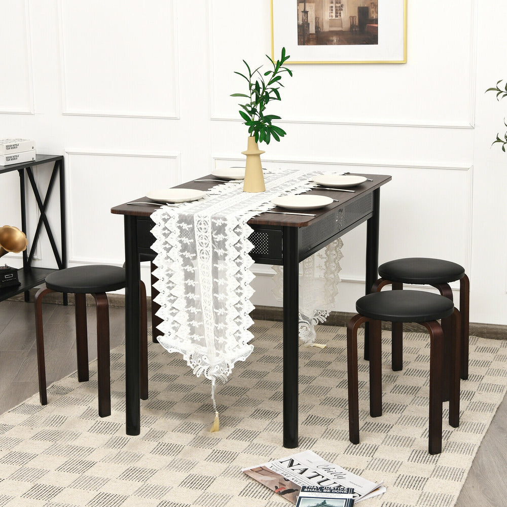 Set of 4 stackable black bentwood stools with padded seats, perfect for dining or space-saving in modern interiors.