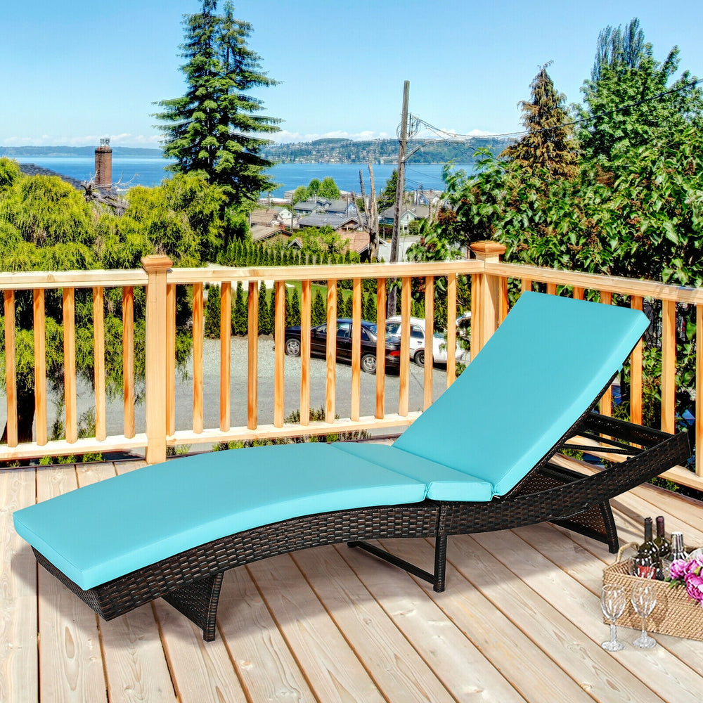 Turquoise patio folding adjustable rattan chaise lounge chair with cushion, perfect for garden or poolside relaxation.