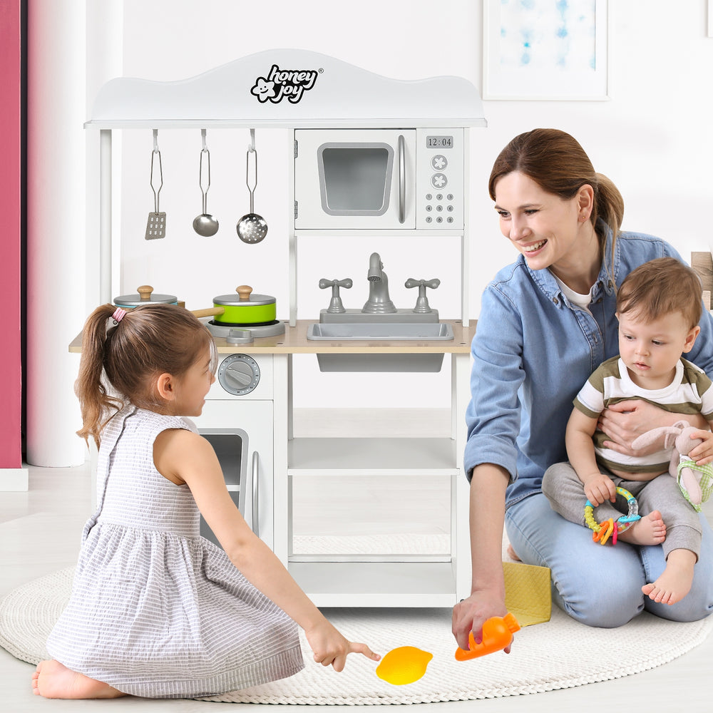 Wooden pretend play kitchen set for kids with realistic sound knobs and ample storage, enhancing imaginative cooking.