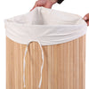 Natural bamboo laundry hamper with a removable liner and PU leather handles for easy transport and storage.