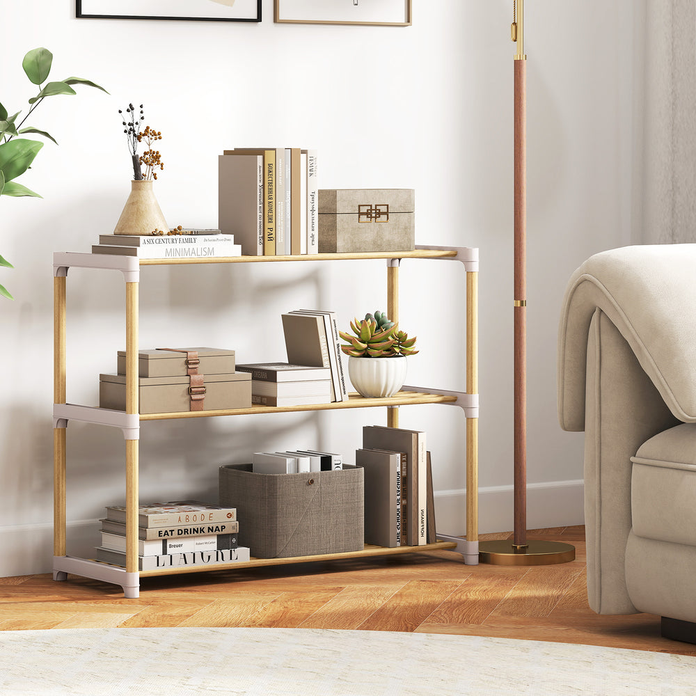 Three-tier solid wood shoe rack with slatted open shelves, showcasing spacious tiers for various shoe types in a.