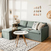 Reversible chaise of the green convertible L-shaped sectional sofa, showcasing its sleek design and soft linen.