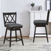 Set of 2 black swivel counter height barstools with rubber wood legs, featuring comfortable PVC seats for home or.
