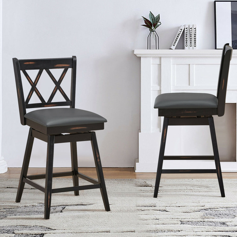 Set of 2 black swivel counter height barstools with rubber wood legs, featuring comfortable PVC seats for home or.