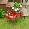 Red wooden wagon plant bed with wheels, featuring two planting sections, ideal for garden or patio decoration.