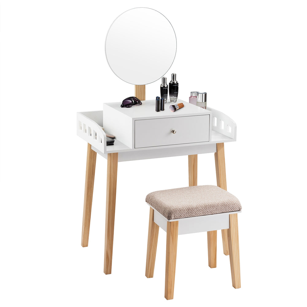 Wooden makeup dressing table set with round mirror, drawer, and cushioned stool, perfect for organizing cosmetics.